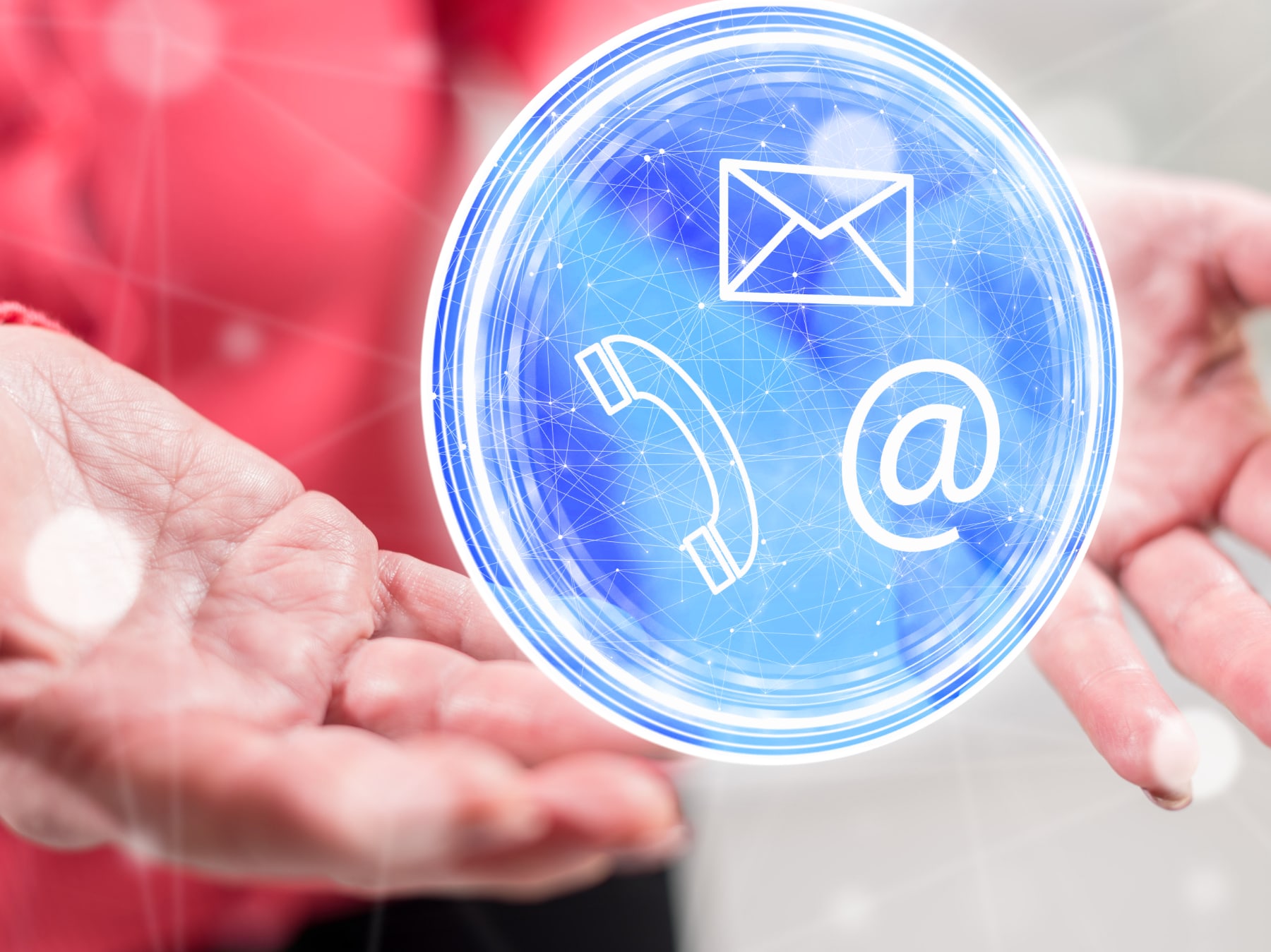 Senior citizen with hands outstretched toward conceptual art of communications: phone, email, postal mailings